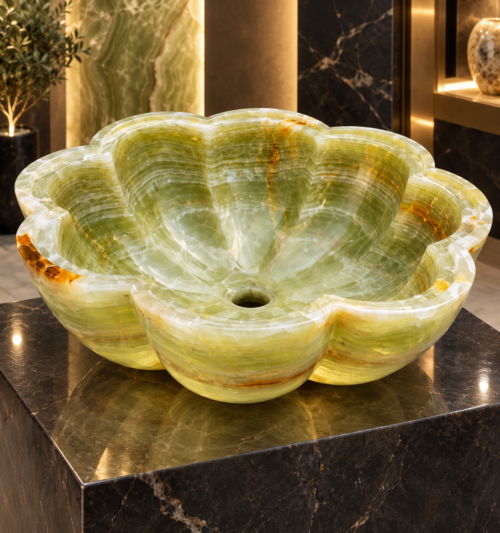 Hand-carved green onyx vessel sink with natural banded stone pattern